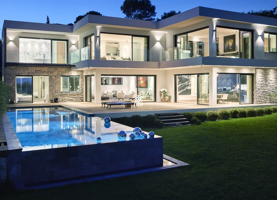 Villa Mila in Mougins at dusk, with its lit pool